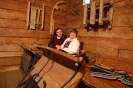 Podlaskie Muzeum Kultury Ludowej, wnętrze starej stodoły, Pani Anna i s. Pia siedzą w starych saniach